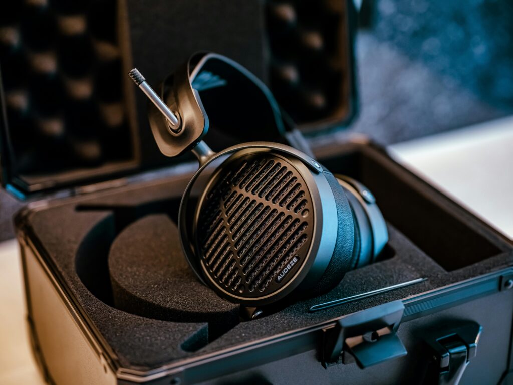 Close-up of premium audiophile headphones stored in a protective case, showcasing modern audio equipment.