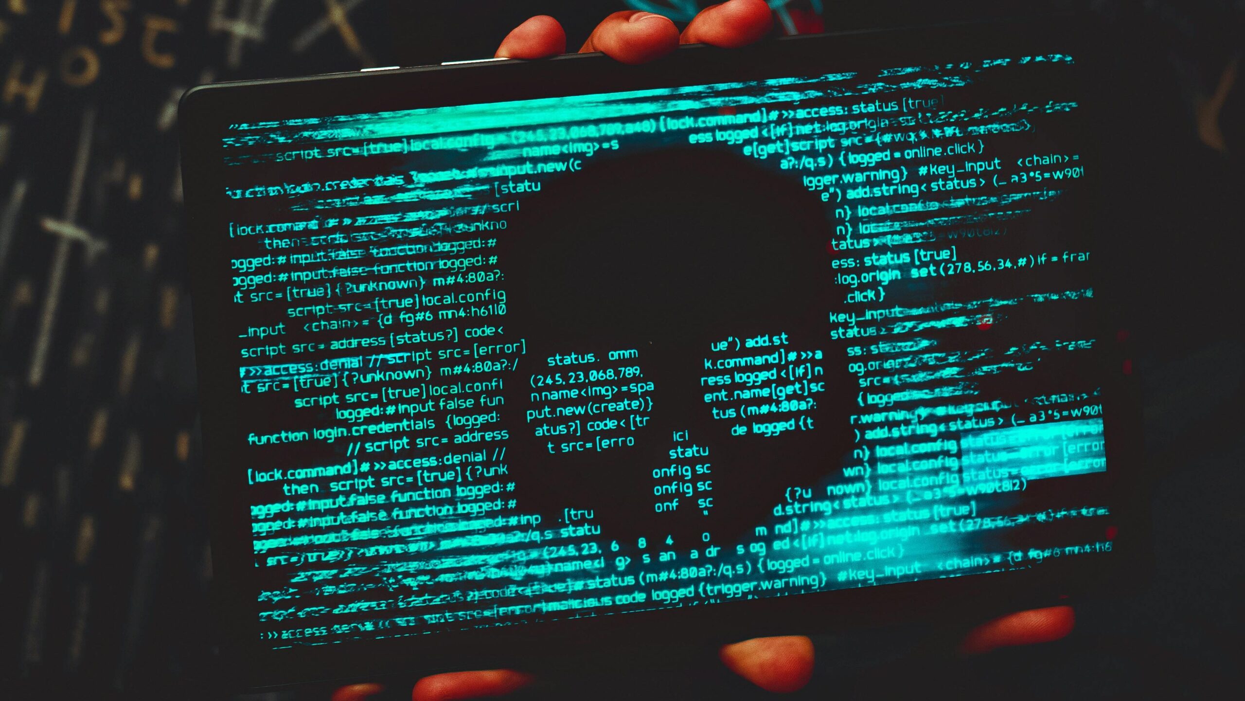 Mysterious hacker with neon mask holding a tablet displaying digital skull against a dark backdrop.